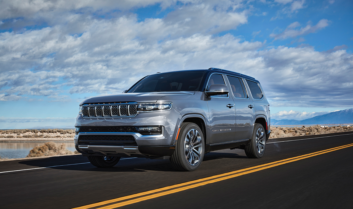 Jeep Grand Wagoneer SUV driving on country road